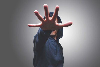 Midsection of person standing against white background