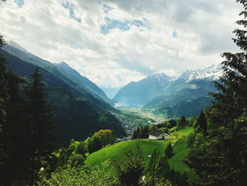 Scenic view of landscape and mountains against sky