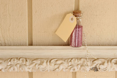 Close-up of decoration hanging on wood