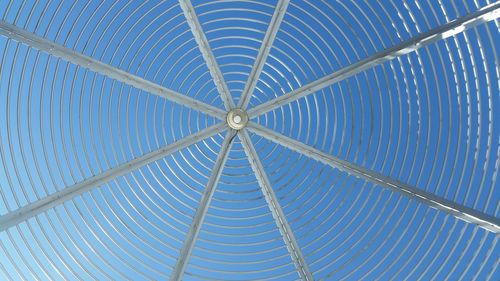 Low angle view of gazebo against blue sky