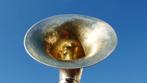 Low angle view of moon against blue sky