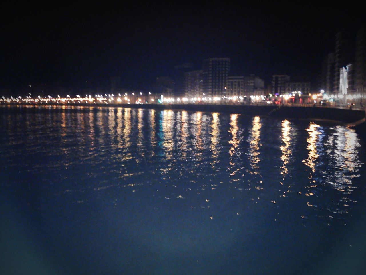 water, reflection, illuminated, waterfront, river, night, city, architecture, outdoors, no people, built structure, nature, building exterior, sky, cityscape, beauty in nature