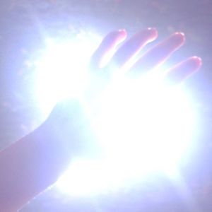 Close-up of hand against sky