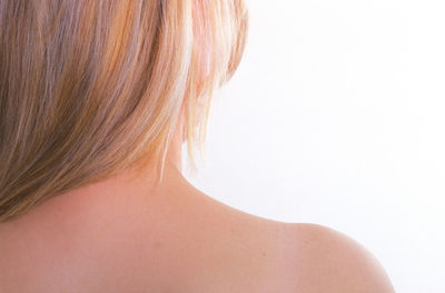 Rear view of woman against white background