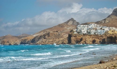 Panoramic view of sea and mountains against sky