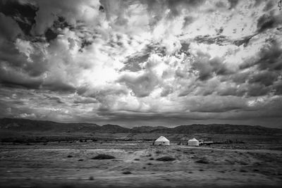 Scenic view of sea against storm clouds