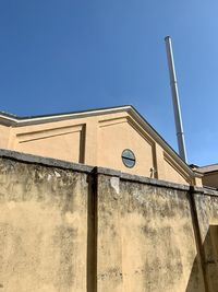 Low angle view of building against clear blue sky