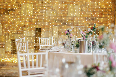 Flower vase and empty glass on dinning table