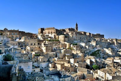 Townscape against clear blue sky