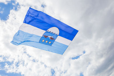 Low angle view of flag against sky