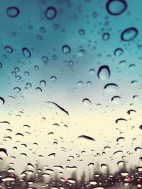 Close-up of water drops on glass