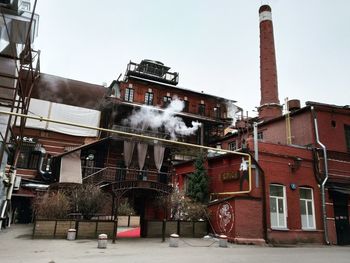 View of factory against sky