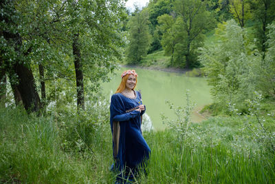 Woman standing in a forest