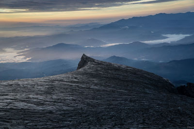 Scenic view of mountains against sky during sun rise at south peak