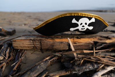 Close-up of hat on wood