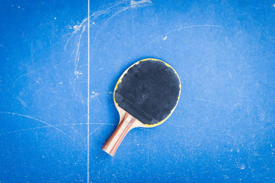 Close up of tennis racket on table