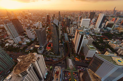 Cityscape against sky during sunset