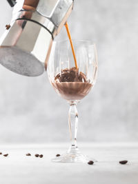 Close-up of wineglass on table