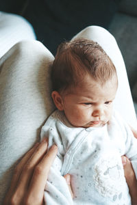 High angle view of baby mother and daughter