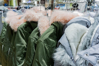 Close-up of people relaxing in snow