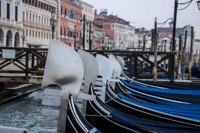 Gondolas tied up at the pier on st. mark's square.