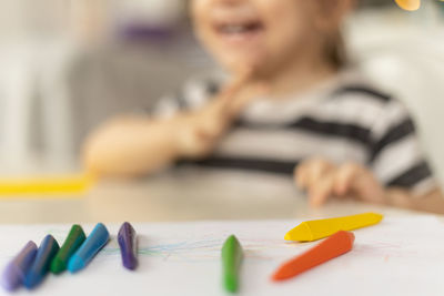 Cropped hand of woman holding colorful toys