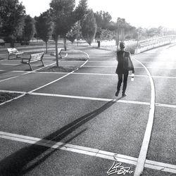 Full length of woman standing by railing