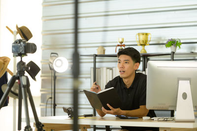 Young man working on table