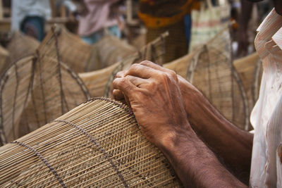 Midsection of man working at market