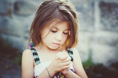 Close-up of girl holding water