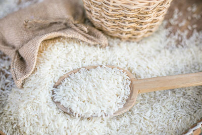 High angle view of rice spilling on table