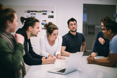 Group of people working on table