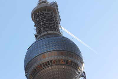 Low angle view of building against clear blue sky