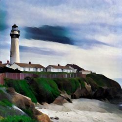 Lighthouse against cloudy sky