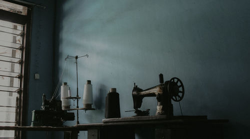 Old machinery on wall by home industry