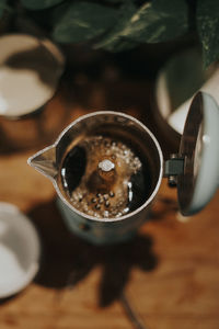 High angle view of coffee cup on table