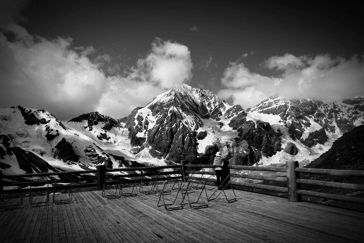 mountain, snow, sky, winter, cold temperature, mountain range, tranquil scene, tranquility, cloud - sky, scenics, beauty in nature, landscape, nature, season, weather, cloud, cloudy, snowcapped mountain, tree, non-urban scene