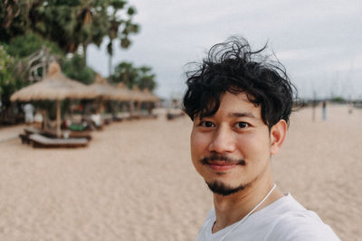 Portrait of young man on beach