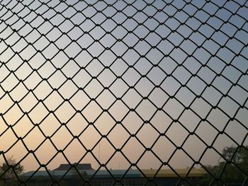 Close-up of chainlink fence against clear sky