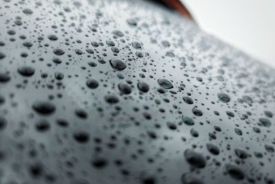 High angle view of raindrops on glass