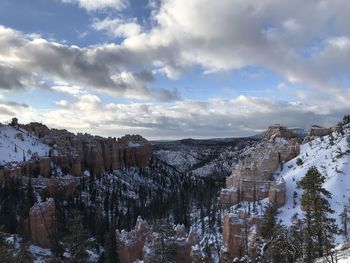 Panoramic view of snowcapped mountain against cloudy sky