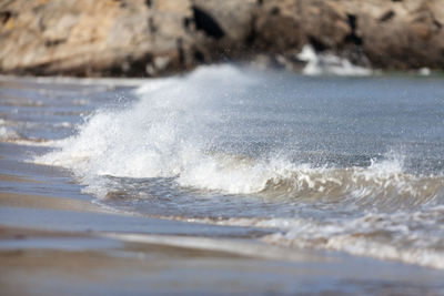 Waves splashing on shore