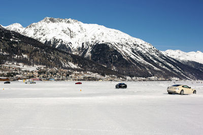 Scenic view of snowcapped mountains against clear sky