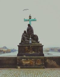 Statue against clear sky in city