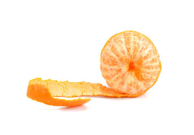 Close-up of orange slice against white background