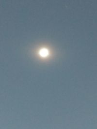 Low angle view of moon against clear sky