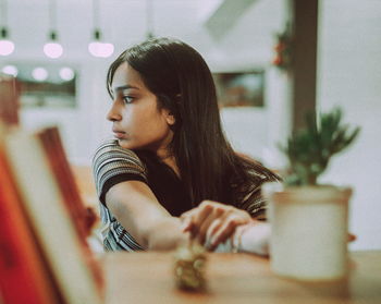 Close-up of young woman at home