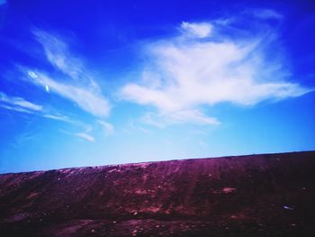 Low angle view of blue sky over land