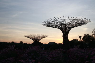 Low angle view of silhouette trees on field against sky