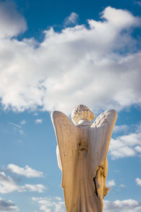 Low angle view of statue against sky